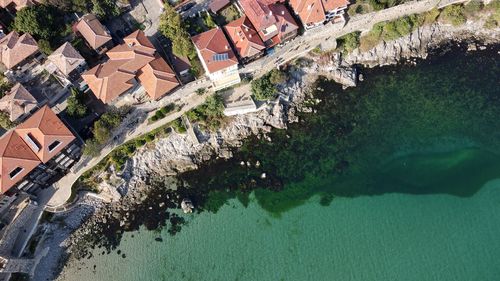 High angle view of river amidst buildings