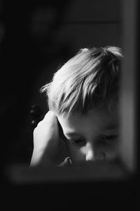 Close-up portrait of boy looking away