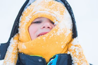 Close-up portrait of girl in snow