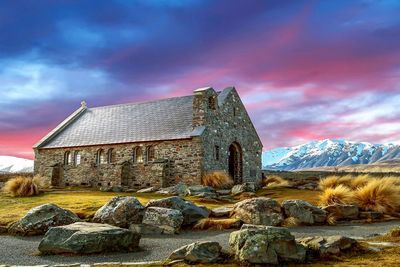 Abandoned house on mountain against sky