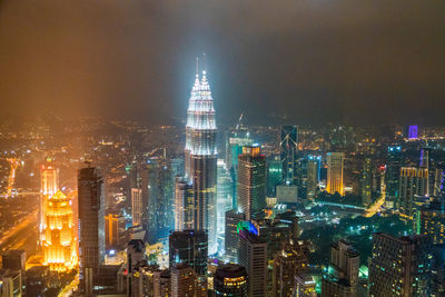 Aerial view of illuminated cityscape at night