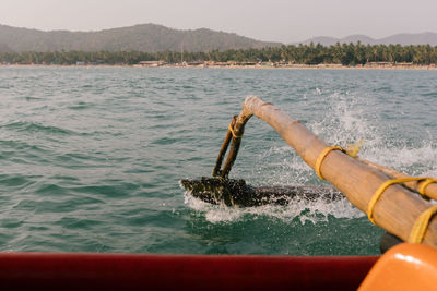 Scenic view of sea against mountain
