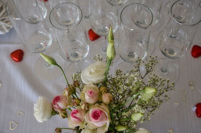 High angle view of white roses on table