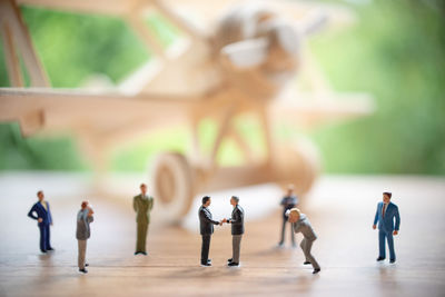 Close-up of figurines and model airplane on table