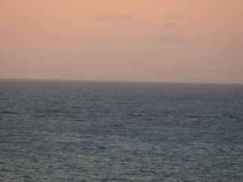 Scenic view of sea against clear sky during sunset