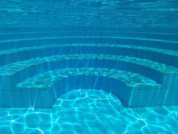 Steps in blue swimming pool
