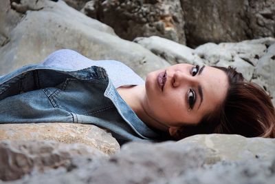 Portrait of young woman lying down