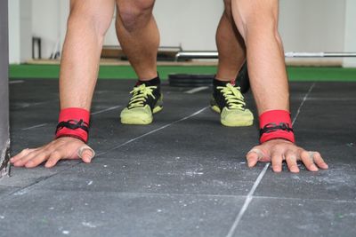 Low section of man standing on floor