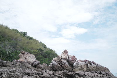 Rocks on mountain against sky
