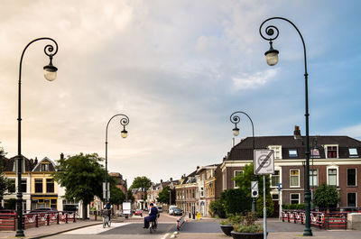 Street light by road against sky