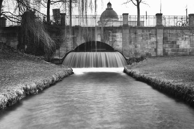 Dam against sky in city