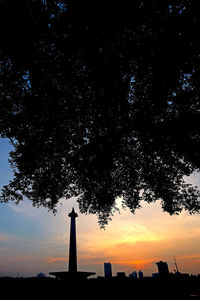 Low angle view of silhouette tree against sky during sunset