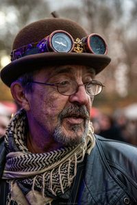 Close-up of man wearing navigational compass