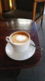 High angle view of coffee cup on table