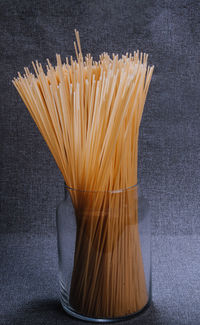Close-up of bread in container against black background