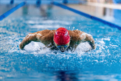 Portrait of boy swimming in pool