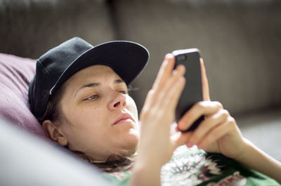 Young woman looking at cell phone