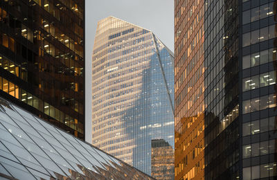 Low angle view of modern buildings against sky in city