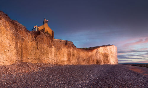 A church on the seven sisters cliffs in the sunset