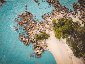 Aerial view of the beach and rocks from the top down