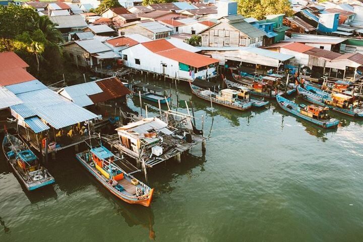 HIGH ANGLE VIEW OF BOATS IN CANAL