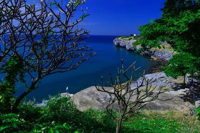 Scenic view of sea against blue sky