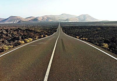 Road leading towards mountains