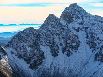 Scenic view of snowcapped mountains against sky