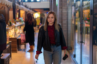 Beautiful woman standing in store