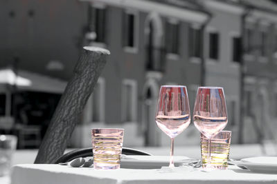 Close-up of wine glasses on table in restaurant