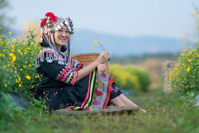 Woman sitting on field