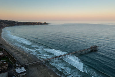 Drone view of scripps pier with pastel colors sunrise