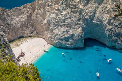 High angle view of rocks by sea