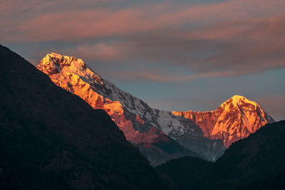 Scenic view of mountain against sky during sunset