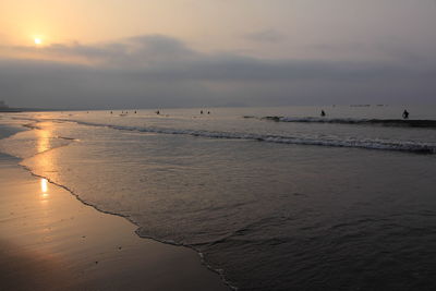 Scenic view of sea against sky during sunset