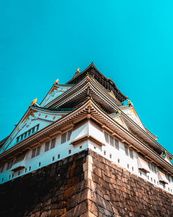 Low angle view of building against clear blue sky