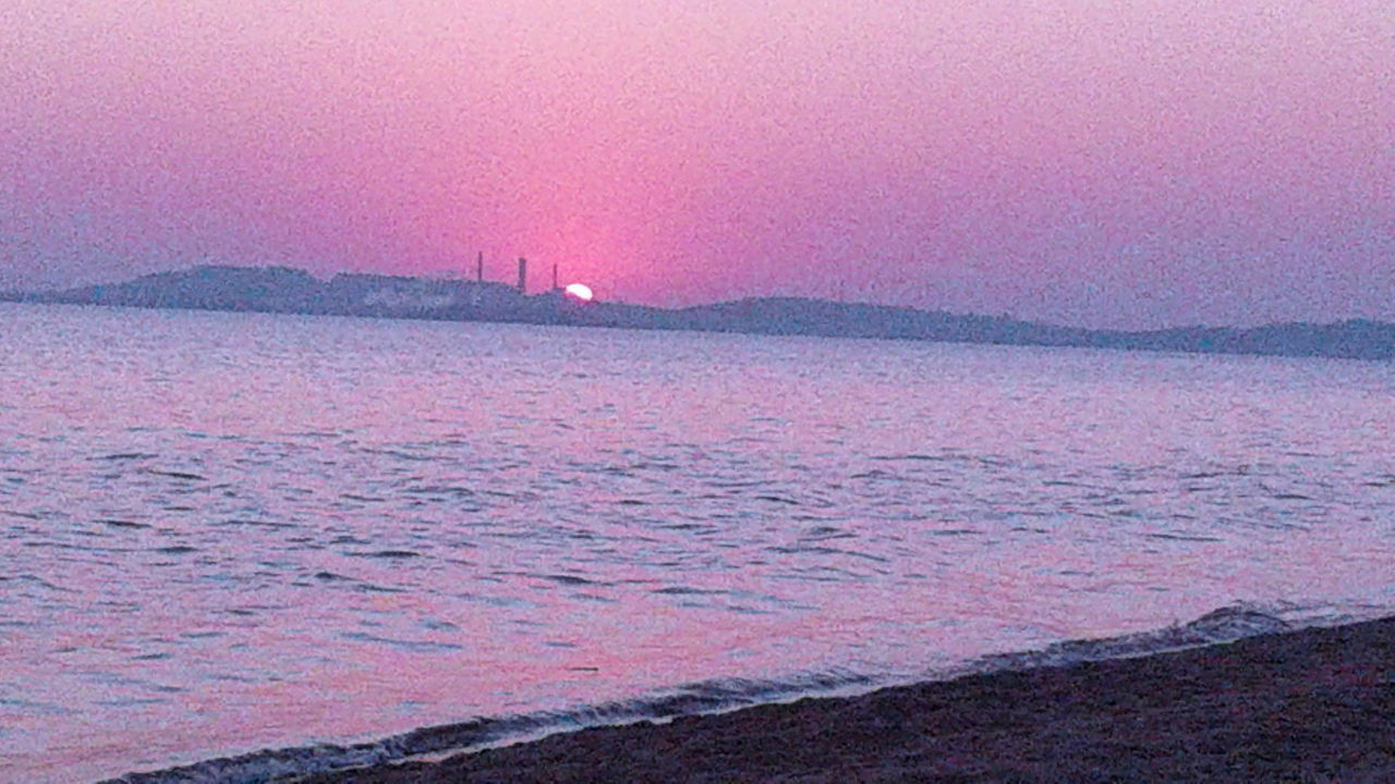 SCENIC VIEW OF SEA AGAINST DRAMATIC SKY