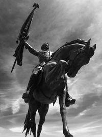 Low angle view of statue against sky
