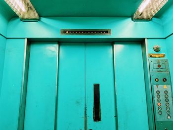 Close-up of blue door of building