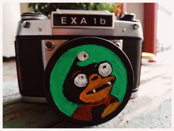 Close-up of camera on table