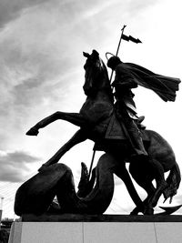 Low angle view of statue against sky