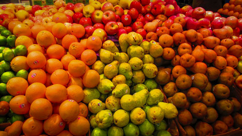 Full frame shot of oranges at market stall