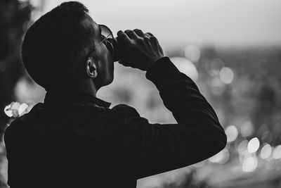 Close-up of man drinking beer