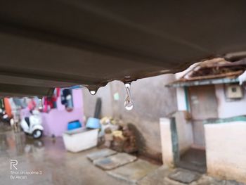 Close-up of clothes hanging on roof of building