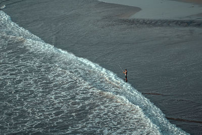 High angle view of person surfing in sea