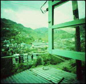 Scenic view of landscape seen through window