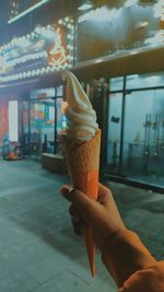 Hand holding ice cream cone