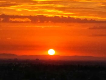 Scenic view of dramatic sky during sunset