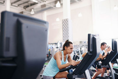 Beautiful woman exercising at gym