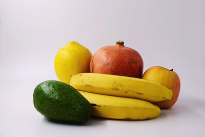 Close-up of oranges against white background